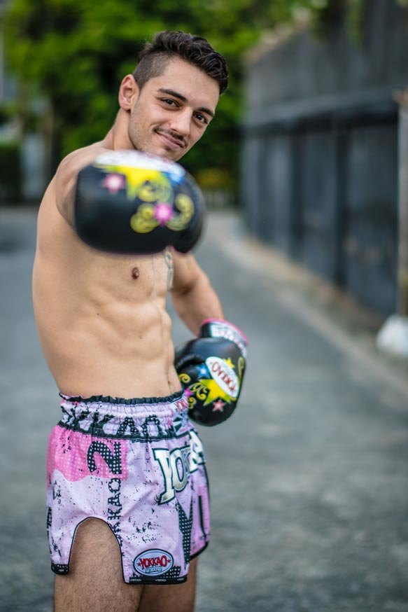 Erhan Güngör in YOKKAO shorts wearing boxing gloves